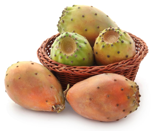 Prickly pear in a basket over white background