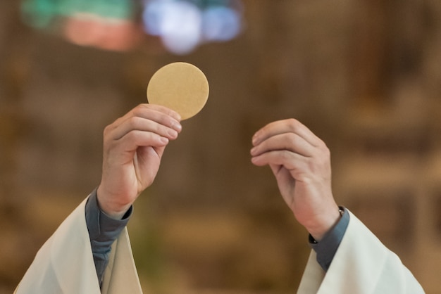 Priest giving Eucharist