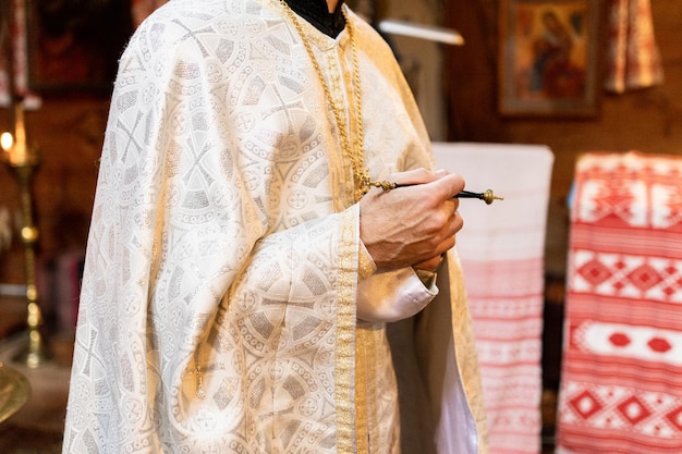 Priest in the old church at the baptism