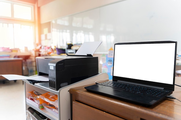 Printer and computer interior of a school classroom wooden floor and desks concept of education and learning