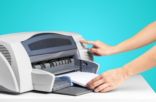 Printer copier machine on a bright blue