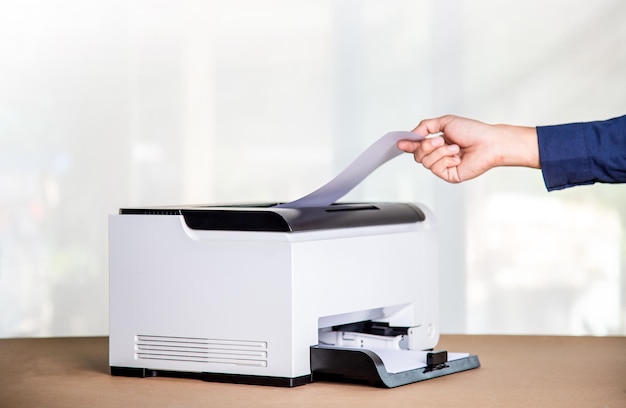 Printer copier scanner in office workplace photocopier machine\
for scanning document printing a sheet paper and xerox\
photocopy