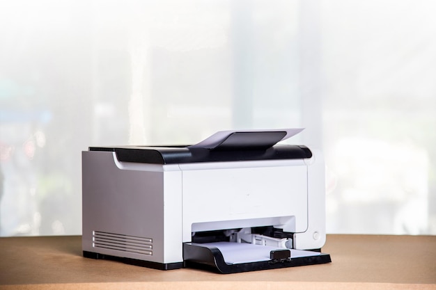 Printer copier scanner in office workplace photocopier machine\
for scanning document printing a sheet paper and xerox\
photocopy