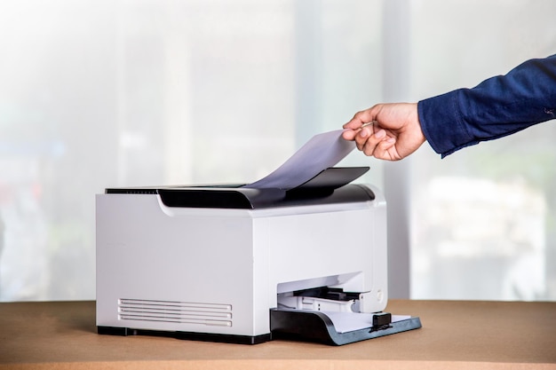 Printer copier scanner in office workplace photocopier machine\
for scanning document printing a sheet paper and xerox\
photocopy