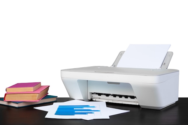 Printer and stack of books on black table against white background