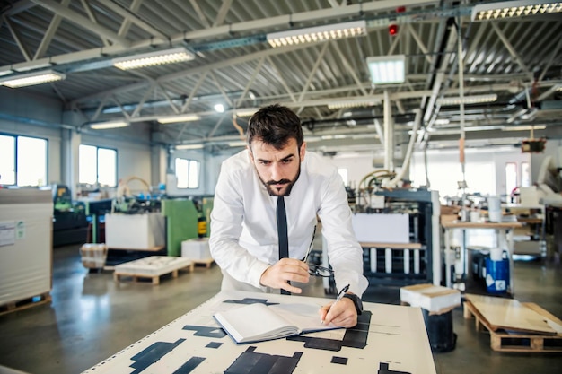 A printing shop engineer analyzing prints