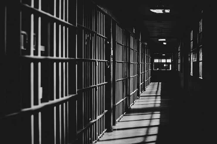 Photo prison bars and a hallway dark background