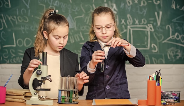 Private school School project investigation School experiment Science concept Gymnasium students with in depth study of natural sciences Girls school uniform busy with proving their hypothesis