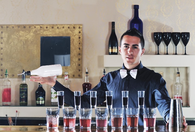 pro barman prepare coctail drink and representing nightlife and party event  concept