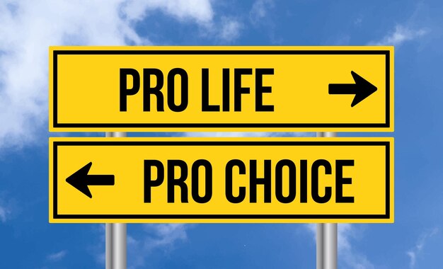 Pro life or pro choice road sign on cloudy sky background