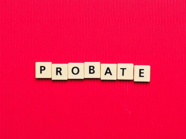 Photo probate word made from square letter tiles on red background.