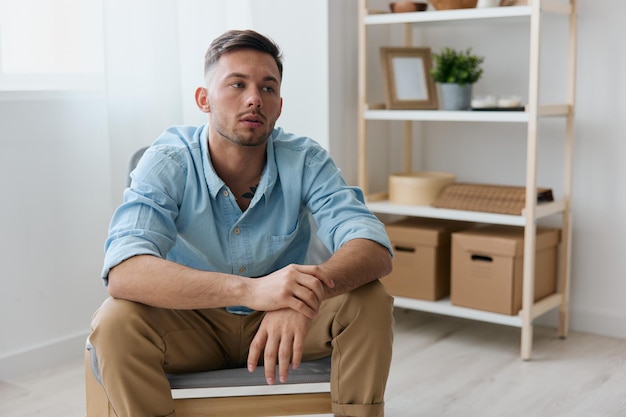 Problems concept upset guy need professional psychology help
have depression frustrated tired sad young handsome man folded arms
looks aside can not make important decision in life sitting at
home