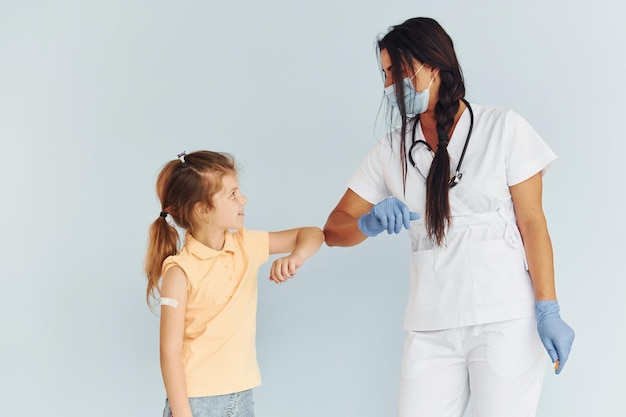 Photo procedure is done doctor in uniform making vaccination to the patient