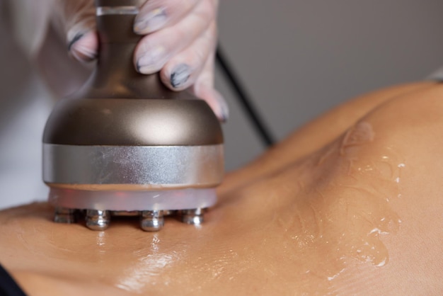 Procedure removing cellulite on female abdomen cavitation belly massage ultrasonic massage for weigh