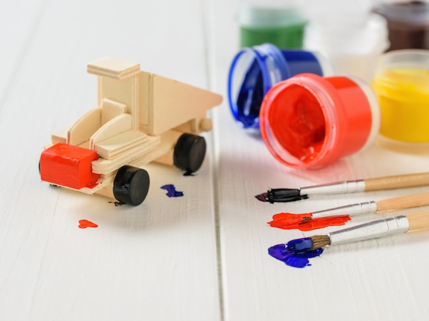 The process of applying paint to a wooden machine