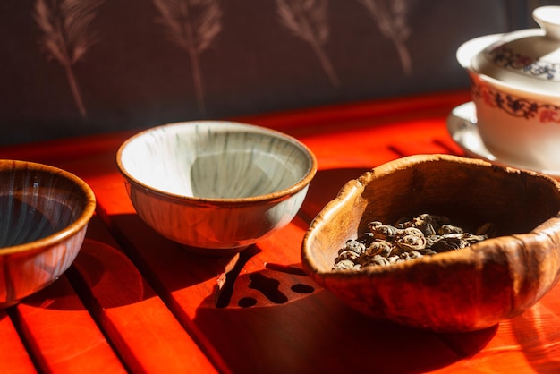 The process of brewing tea at the tea ceremony. Still life with a teapot, two cups and chahe.