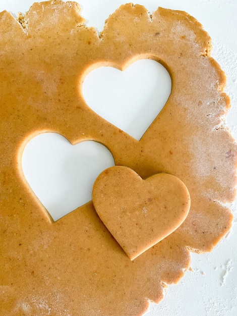 The process of cooking heart cookies Top view raw