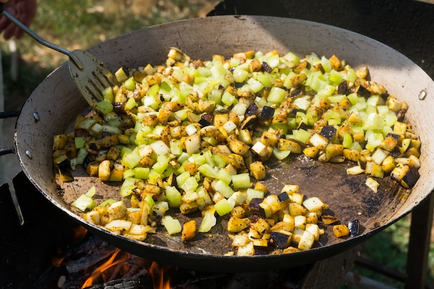 Process of cooking paella with seafood