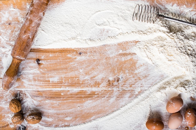 Photo the process of cooking, wooden background, top view