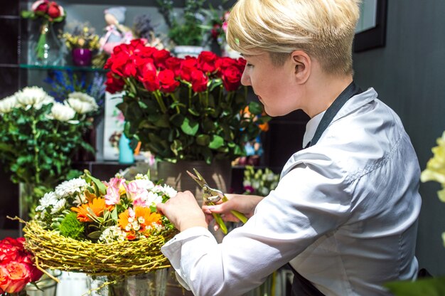 process of creating a bouquet florist flower shop close-up
