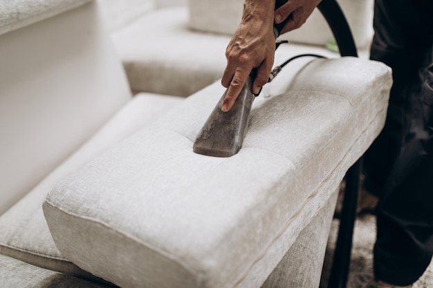 Process of deep furniture cleaning, removing dirt from sofa.\
washing concept.