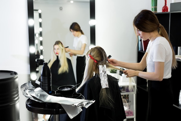 process of dyeing hair at beauty salon