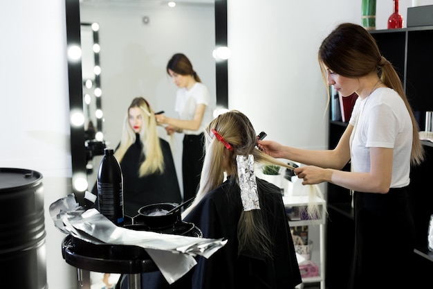 Process of dyeing hair at beauty salon