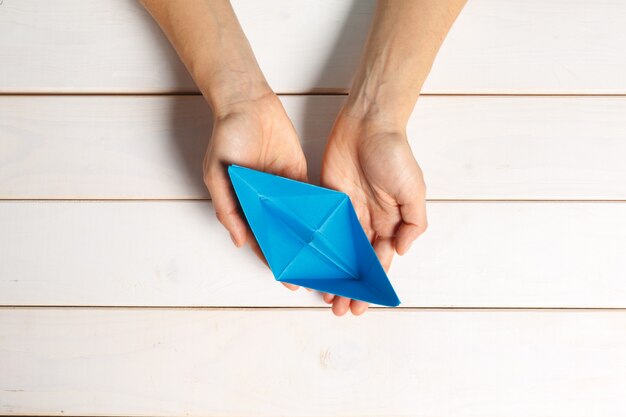 Process of handcrafting origami paper boat