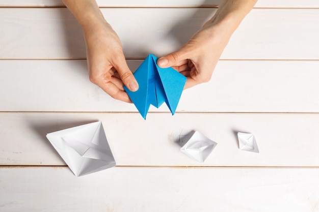 Process of handcrafting origami paper boat