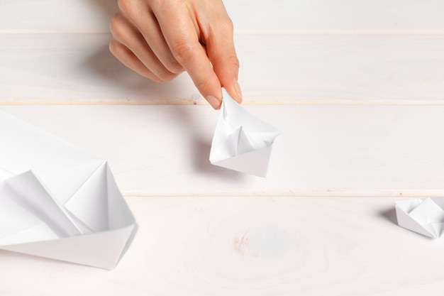 Process of handcrafting origami paper boat