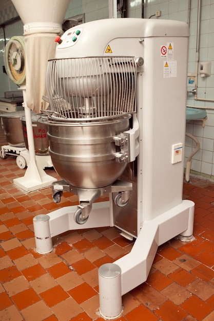 The process of making cookie dough in an industrial kneading machine at the factory