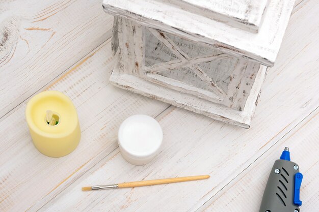 process of making decorative white cardboard lantern for candle