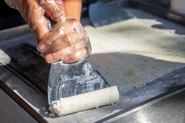 the process of making fruit ice cream on the street delicious food on holiday closeup
