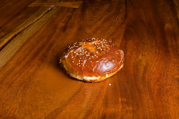 The process of making juicy fresh sesame burgers with beef, meat, cheese, tomatoes, sauce, pineapple