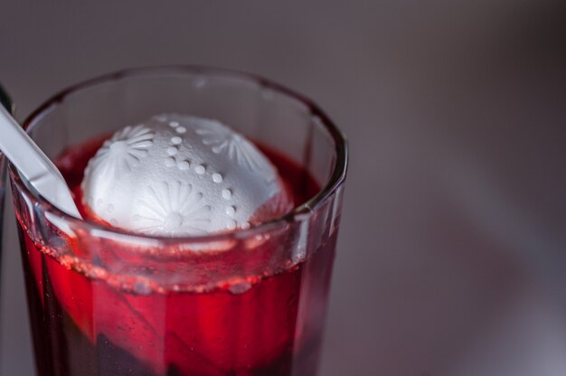 The process of painting Easter eggs with food coloring and melted wax.