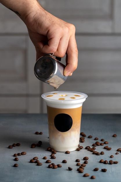 The process of pouring in a sup of coffee milk