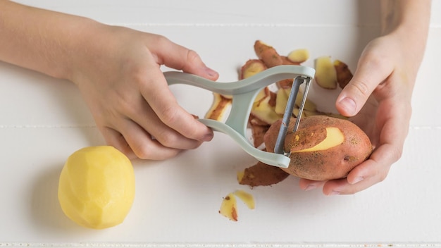 The process of preparing potatoes for cooking Speciale quipment f or c leaning vegetables