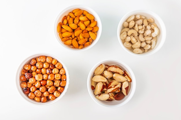 Process of soaking various nuts: almonds, hazelnuts, cashew, brazilian nut in water to activate