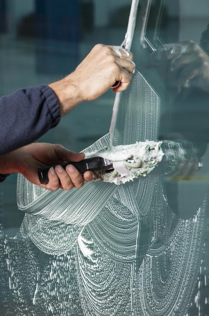 Process of window cleaning with a squeegee