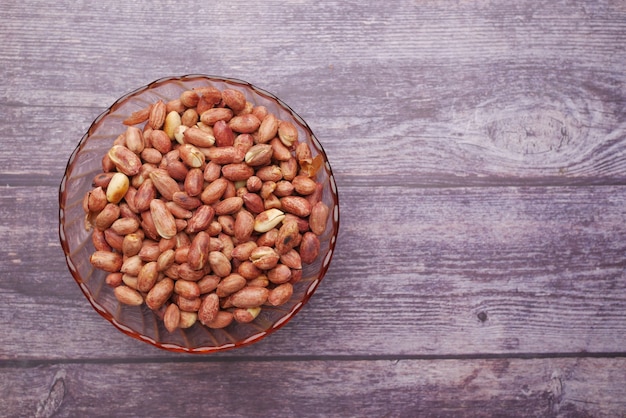 Processed pea nuts in a bowl on table top down