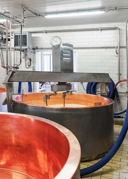 Processing of Gruyere de Comte Cheese in the dairy in Franche Comte, Burgundy, in France.