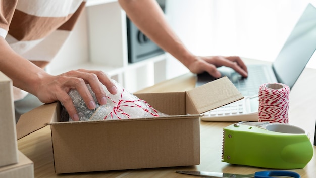 the product supplier checking product in the parcel before sending