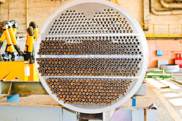 Production of a large tube bundle for a shellandtube heat exchanger in an industrial production room of a shop with equipment at an oil refinery petrochemical chemical plant enterprise