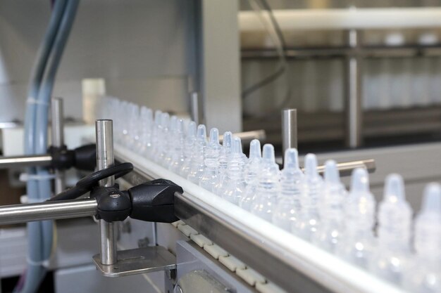 The production line of Bottle Pak Production of nasal drops Sterile medium A line of bottles with medicine Testing of the industrial line