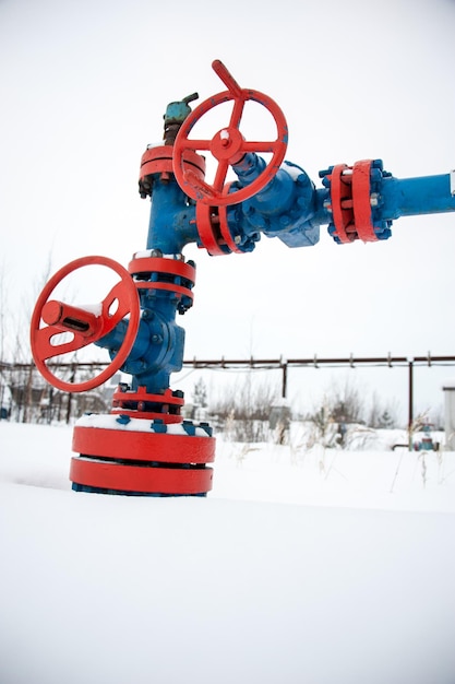 Production wellhead with valve armature. Oil, gas industry. Petroleum theme.