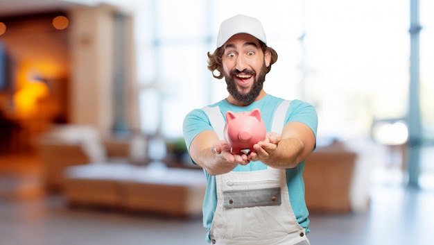 Profesional painter  with a piggy bank