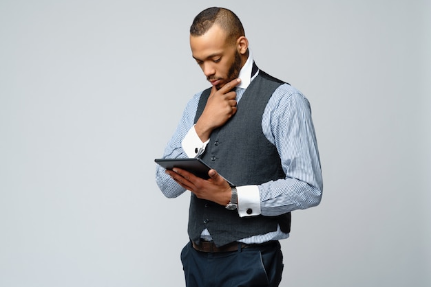 Professional African american business man holding tablet pc