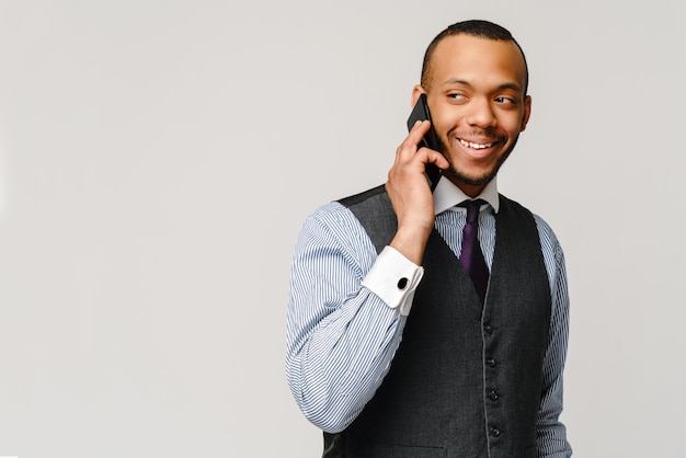 Professional african-american business man talking on mobile cell phone
