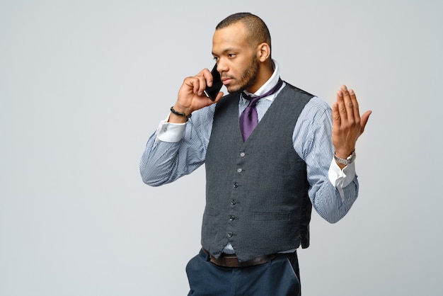 Professional African american business man talking on mobile phone