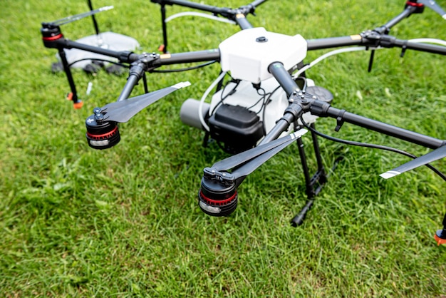 Professional agriculture drone on the green field